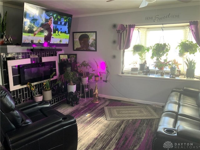 living room featuring crown molding, hardwood / wood-style floors, and ceiling fan