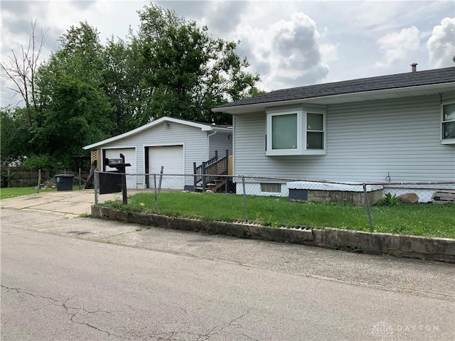 3901 Falmouth Ave, Dayton, OH 45416 - view of front of home featuring a garage and an outbuilding