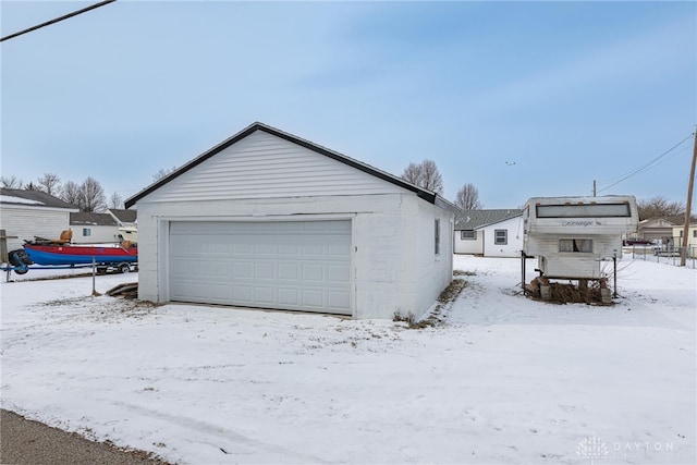 view of snow covered garage