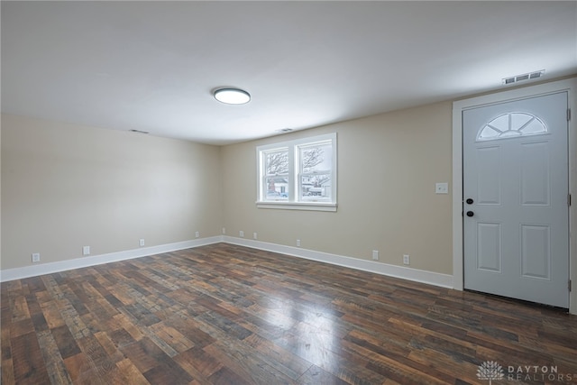 foyer entrance featuring dark wood-type flooring