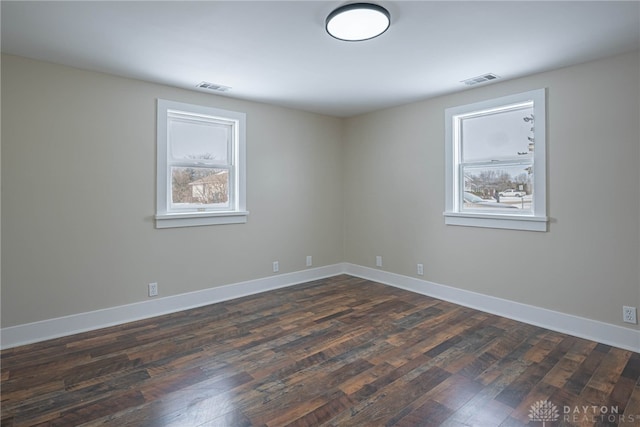 empty room featuring dark hardwood / wood-style floors