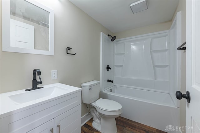 full bathroom with hardwood / wood-style flooring, toilet, vanity, and  shower combination