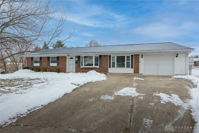 ranch-style house featuring a garage