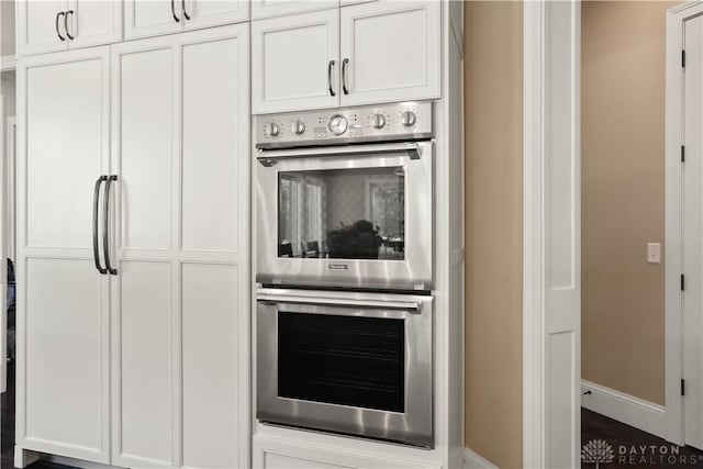 kitchen with white cabinets and double oven