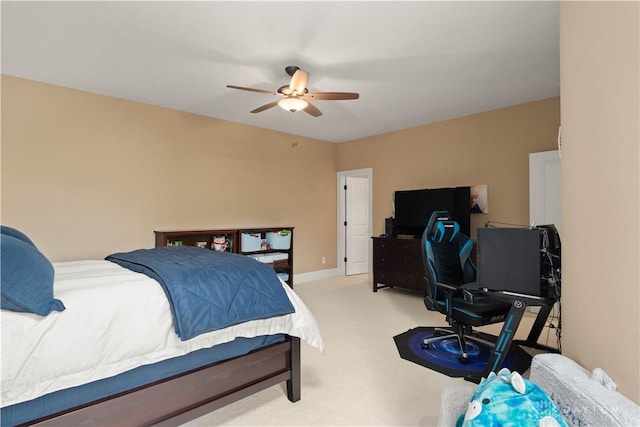 bedroom with light carpet and ceiling fan