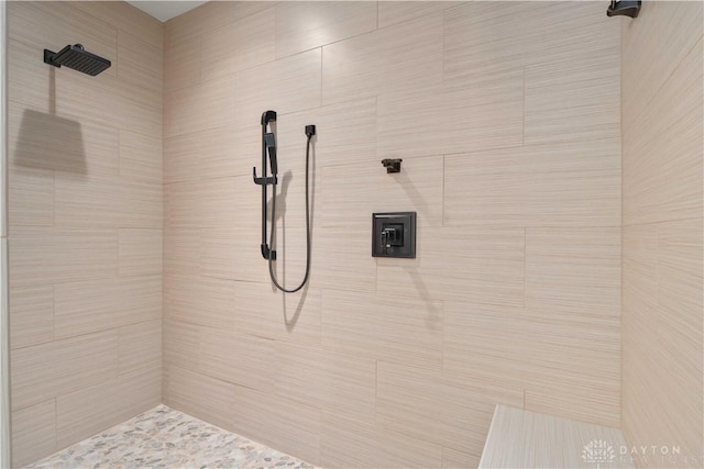 bathroom with a tile shower