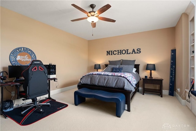 bedroom featuring light colored carpet and ceiling fan