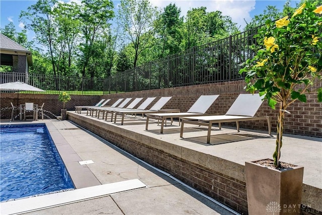 view of swimming pool with a patio area