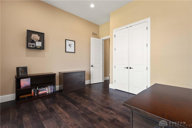 office space featuring dark wood-type flooring