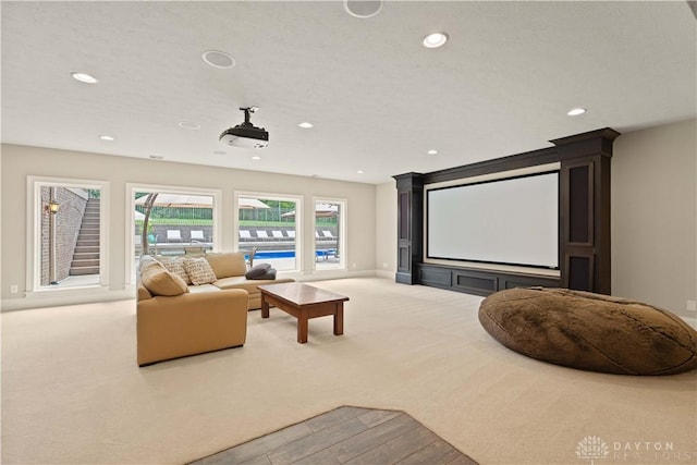 home theater featuring light colored carpet