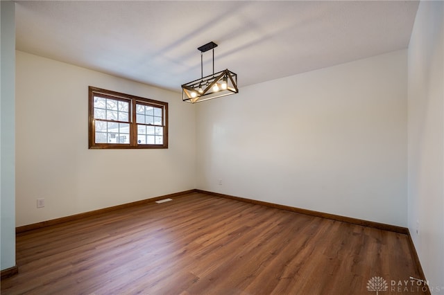 empty room featuring dark hardwood / wood-style floors