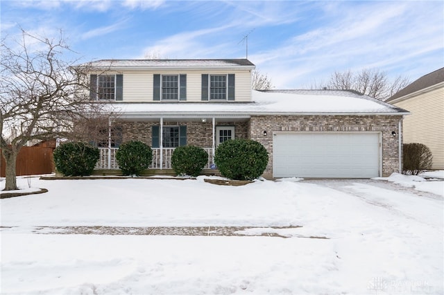 view of front property with a garage and covered porch