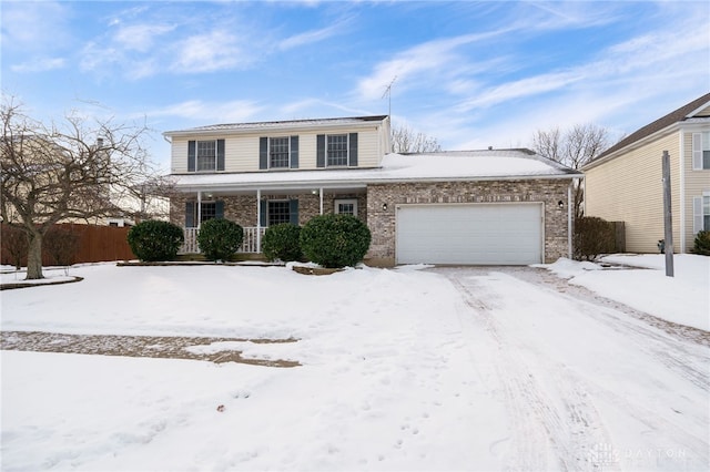 front of property featuring a garage and covered porch