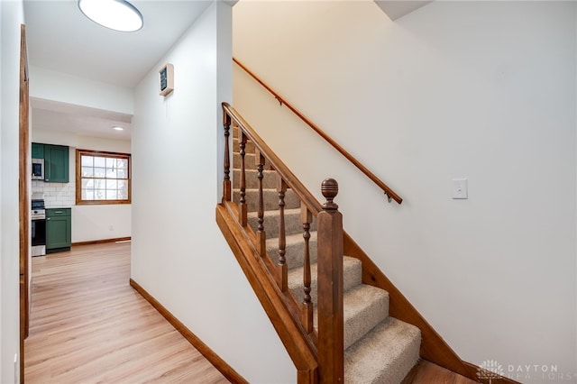 stairway with wood-type flooring