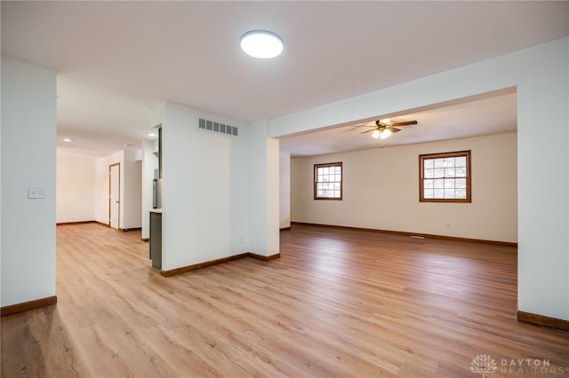 unfurnished room featuring ceiling fan and light hardwood / wood-style flooring