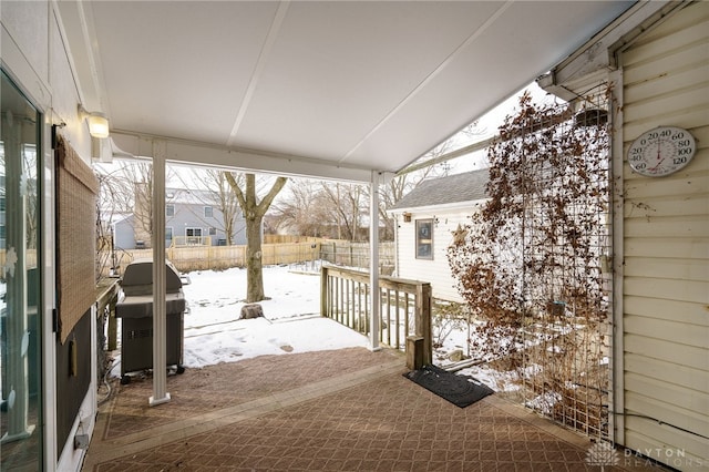 snow covered patio featuring grilling area