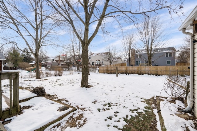 view of yard layered in snow