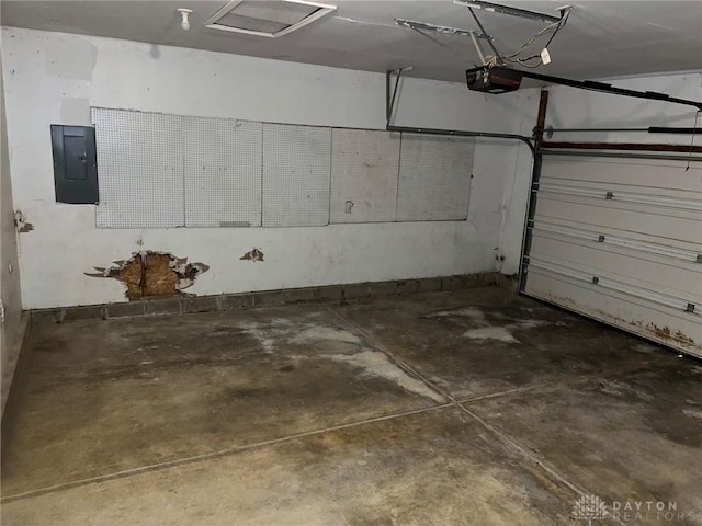 garage featuring electric panel and a garage door opener