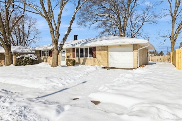 single story home featuring a garage