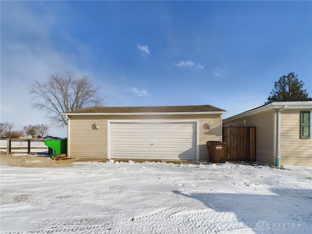 view of snow covered garage