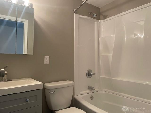 full bathroom with shower / bath combination, toilet, and vanity