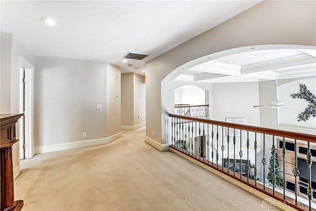 hall with beamed ceiling, coffered ceiling, and carpet