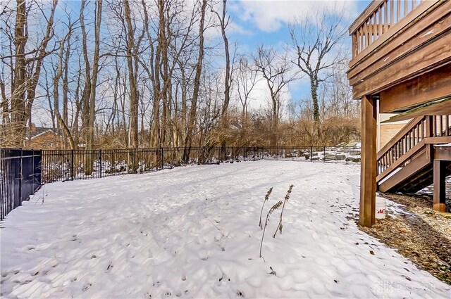 view of yard layered in snow