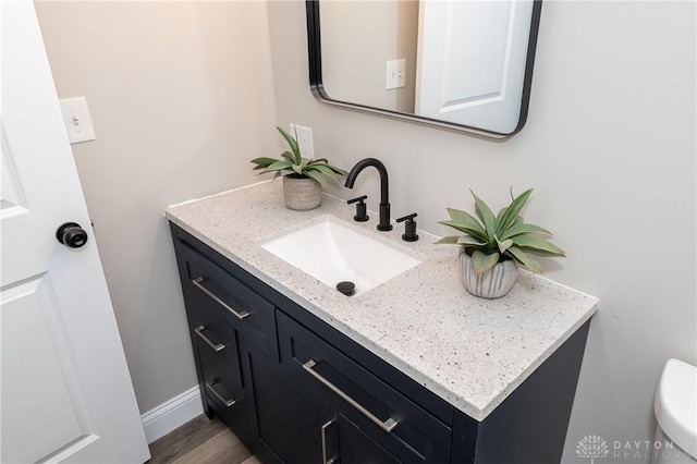 bathroom featuring hardwood / wood-style floors and vanity