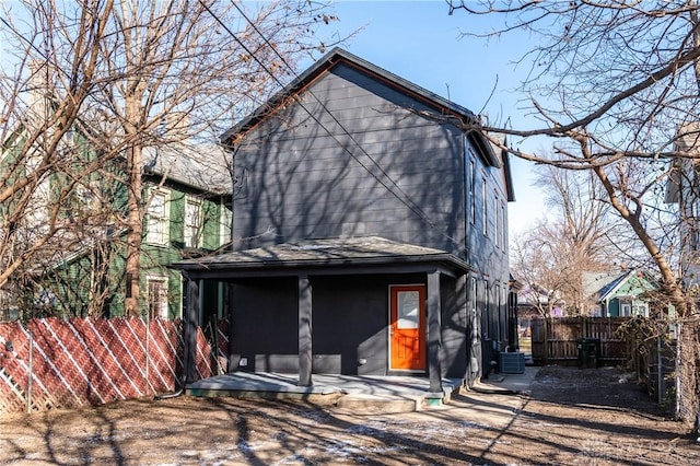 rear view of house with central air condition unit