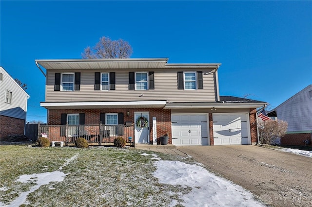 view of front of property with a porch and a garage