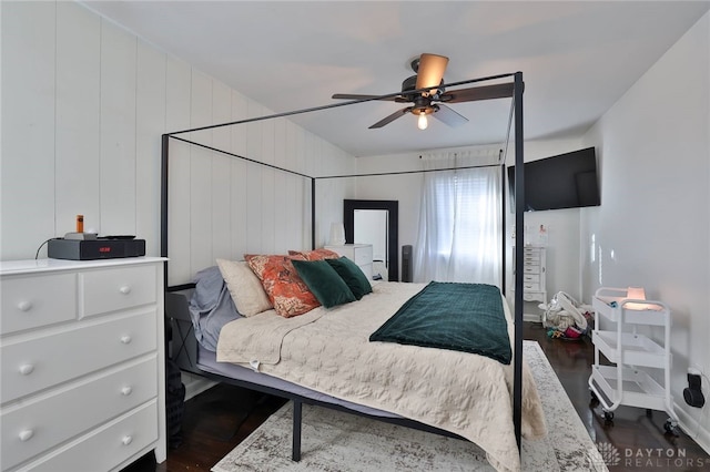 bedroom with ceiling fan and dark hardwood / wood-style floors