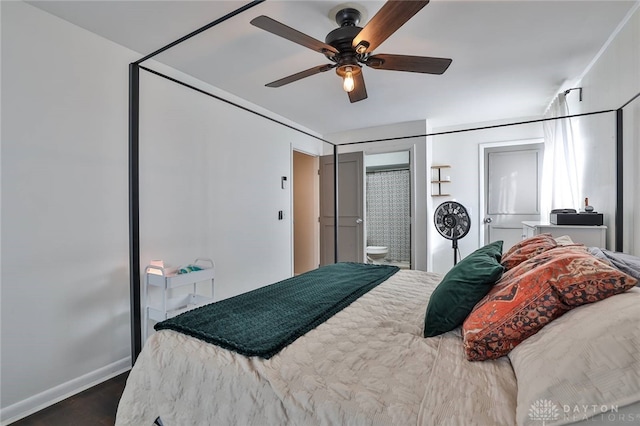 bedroom featuring ceiling fan and ensuite bath