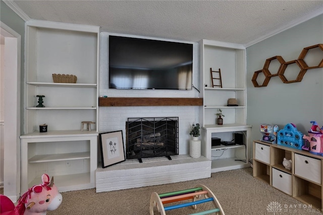 playroom with crown molding, carpet flooring, a textured ceiling, and a brick fireplace