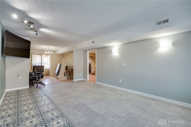 basement with a textured ceiling