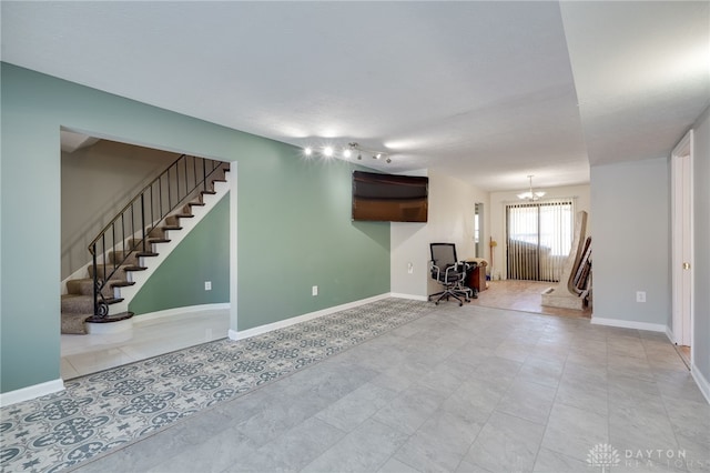 interior space featuring an inviting chandelier and light tile patterned floors