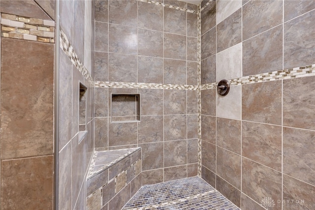 bathroom featuring a tile shower