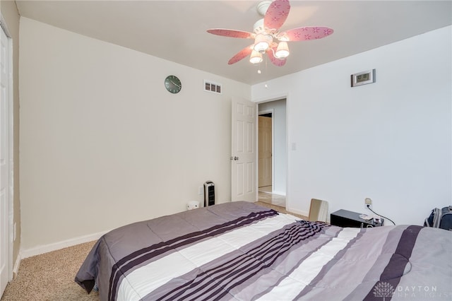 carpeted bedroom with ceiling fan