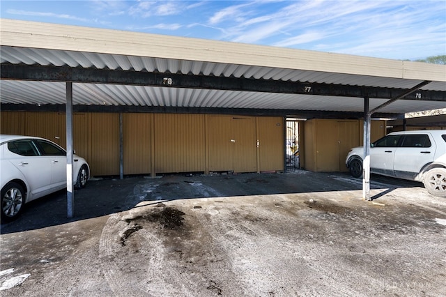 view of parking / parking lot with a carport