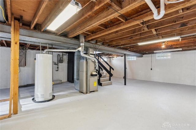 basement featuring heating unit and gas water heater