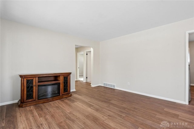 unfurnished living room featuring light hardwood / wood-style floors