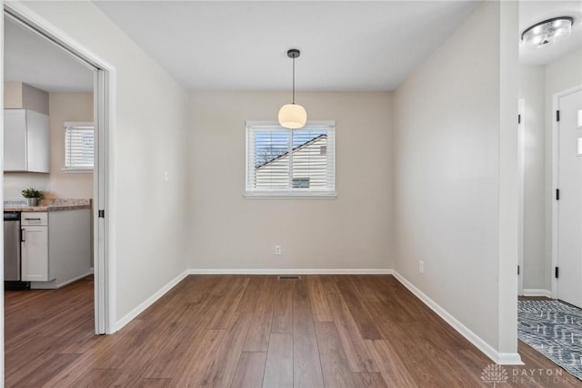 unfurnished dining area with hardwood / wood-style floors