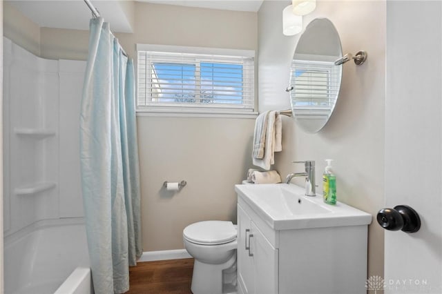 full bathroom with vanity, hardwood / wood-style floors, shower / bathtub combination with curtain, and toilet