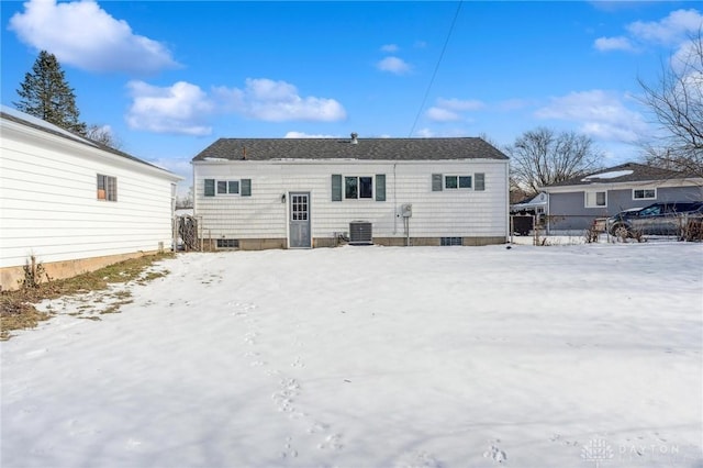 snow covered property featuring cooling unit