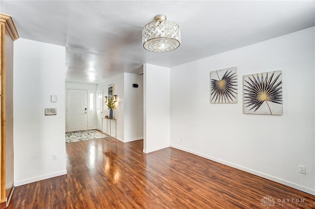 empty room featuring dark wood-type flooring