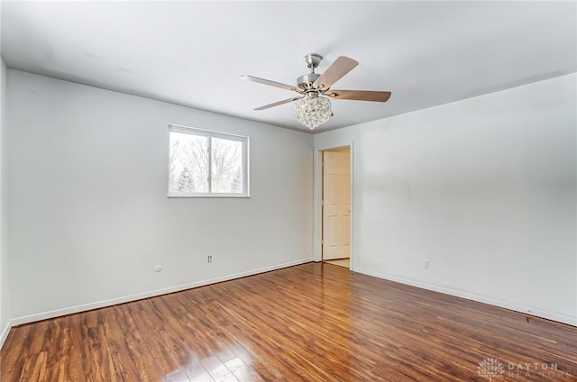 empty room featuring ceiling fan and wood-type flooring