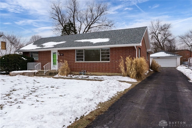 view of front of home with an outbuilding and a garage