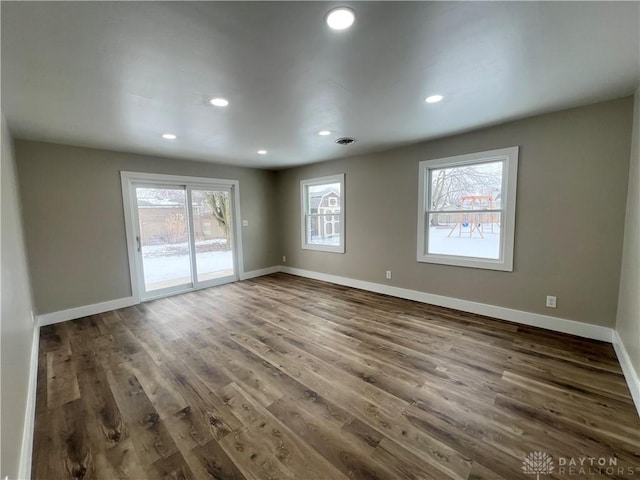 empty room featuring dark wood-type flooring