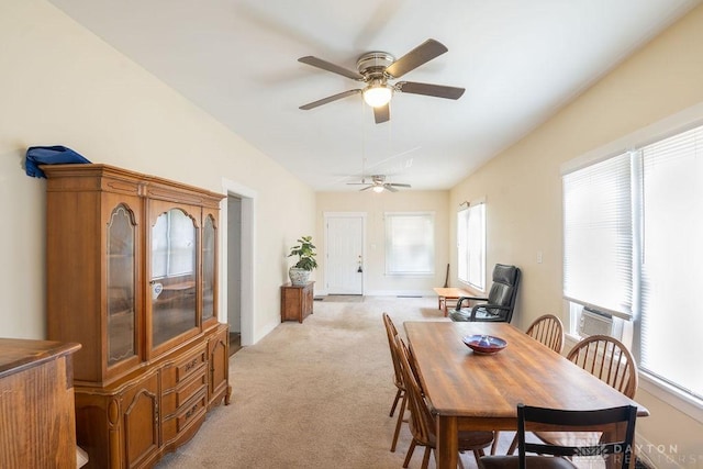 carpeted dining room with a wealth of natural light