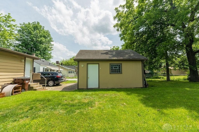 view of outdoor structure with a lawn