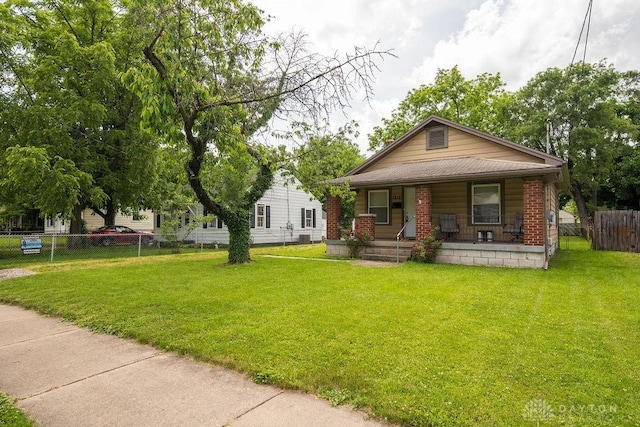 bungalow-style house with a front yard and a porch